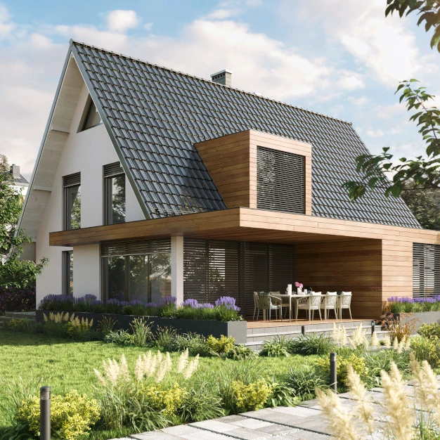 Modernes Wohnhaus mit grauem Dach Holz-Terrasse und grüner Gartenanlage